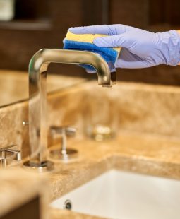 Professional cleaning the bathroom after guests leave